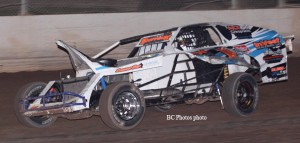 Craig Priewe’s car didn’t look pretty after he was involved in an accident during the feature the final points night of the year at Beaver Dam Raceway in 2009. He still drove it to a fifth place finish and won the Modified track championship by one point. (Photo courtesy BC Photos)