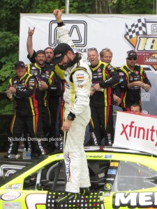 Paul Menard and his crew celebrate after winning the NASCAR XFINITY Series race, the Road America 180 Fired Up by Johnsville, at Road America in Elkhart Lake. Aug. 29.