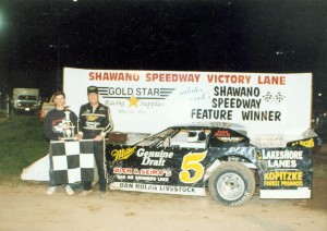Bert Lehman presents a trophy to M.J. McBride on Sept. 4, 1993 after McBride won the Late Model feature. The trophy was courtesy the Lehman family in memory of Paul Lehman, who died earlier that summer. Dan Lewis photo
