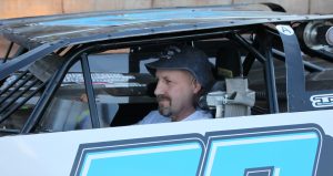 Dean McBride waiting on the frontstretch at Shawano Speedway for the start of a tribute to his dad, M.J. (Randy Van Hoof photo)